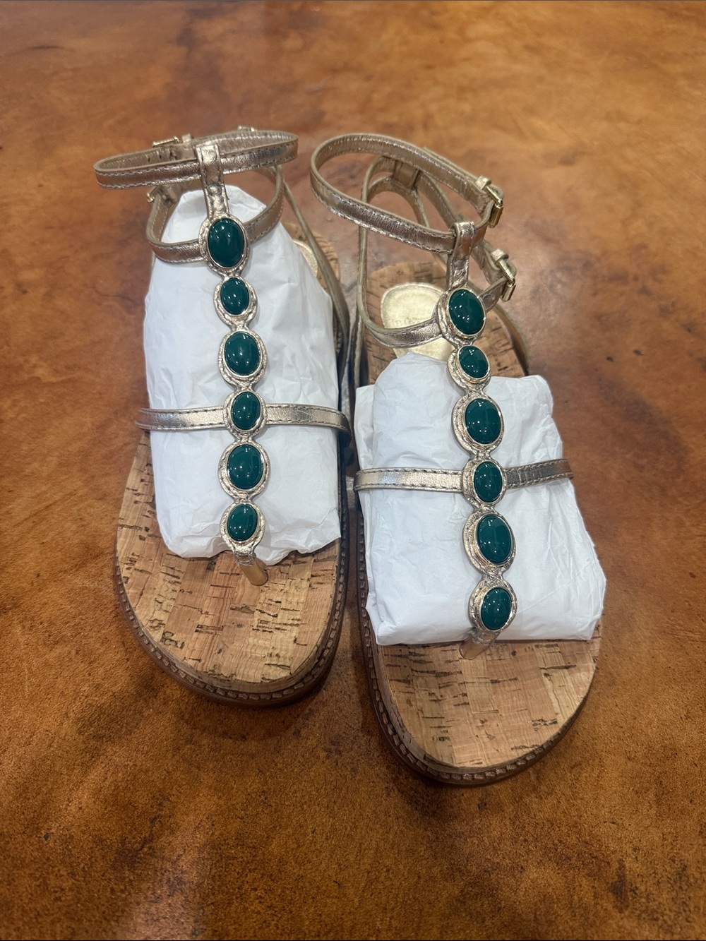 Alexandre Birman Gold T-Strap Sandals with Green Stone Accents